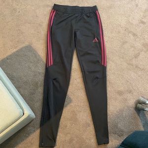 black adidas trainers with burgundy stripes